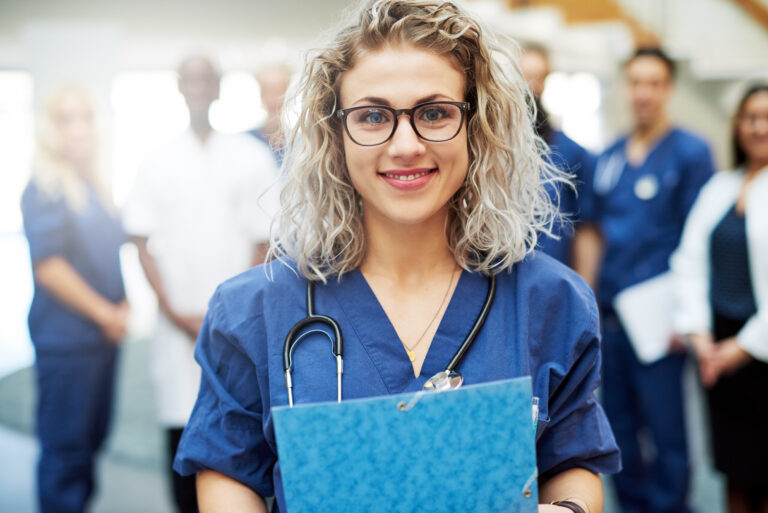 Young clinic staff smiling